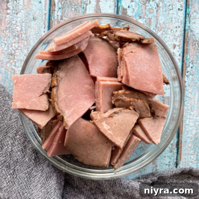 Loaded Philly Cheesesteak Peppers 8 Sliced deli roast beef in a bowl, prepared for the recipe