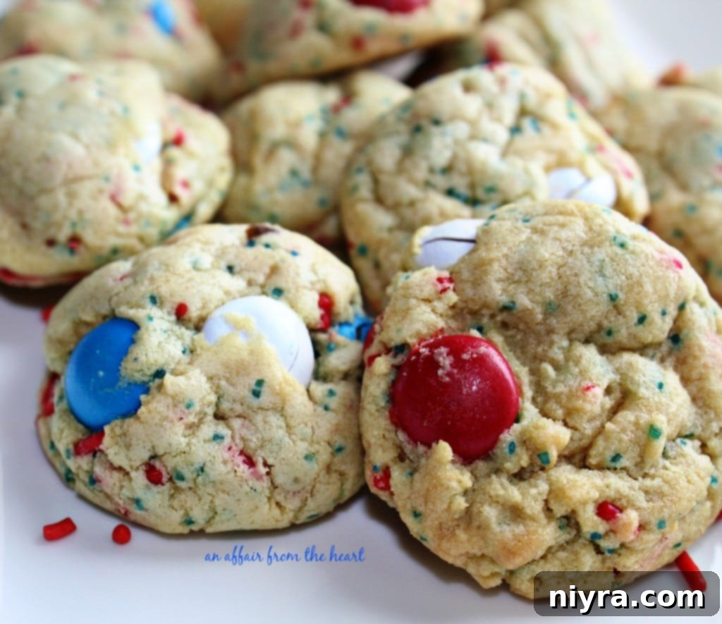 Close-up of patriotic M&M pudding cookies with red, white, and blue M&M's and sprinkles