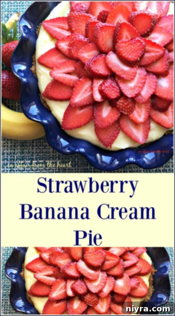 A generous slice of Strawberry Banana Cream Pie showcasing its layers of custard, banana, and strawberries