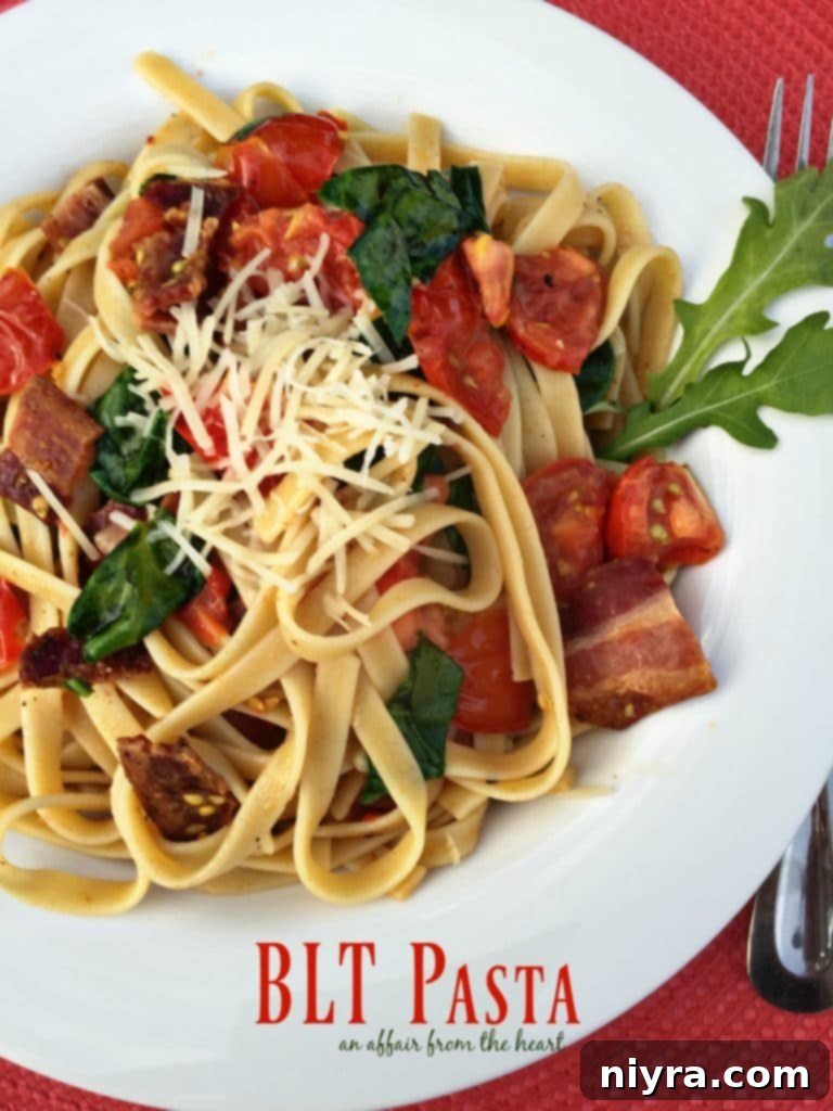 Delicious BLT Pasta in a white bowl, garnished with fresh basil