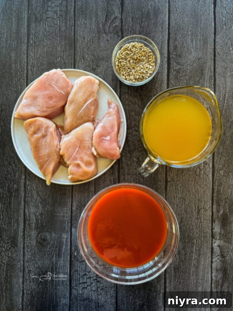 Crisp Buffalo Chicken Lettuce Wraps 5 Chicken breasts, hot wing sauce, and chicken stock - key ingredients for Buffalo Chicken Lettuce Wraps