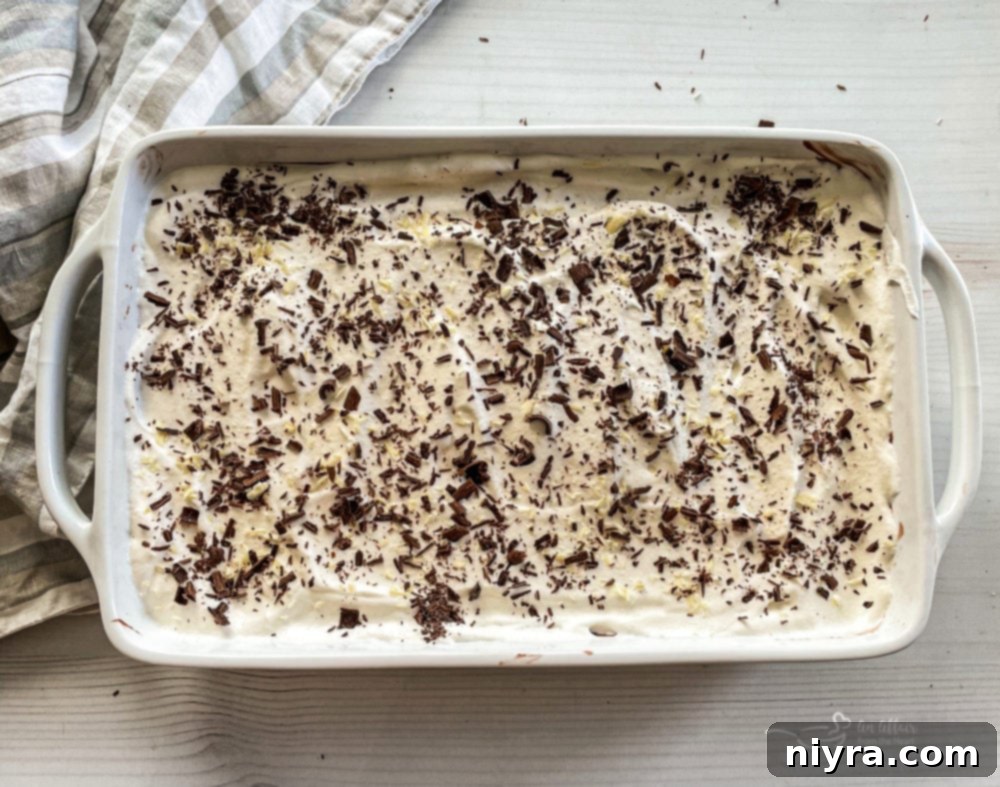 A slice of Chocolate Pudding Poke Cake on a plate, showing layers