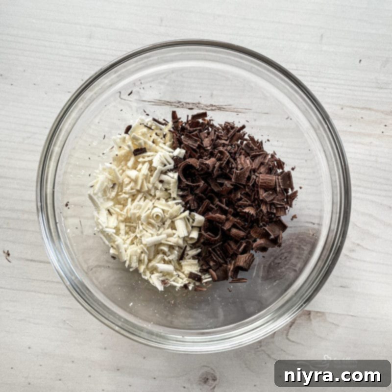 Garnishing the chocolate pudding poke cake with miniature chocolate chips
