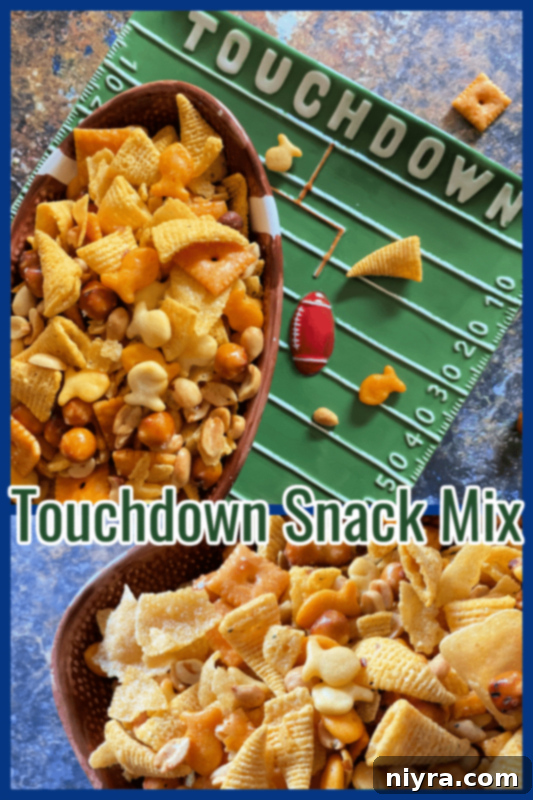 Touchdown Snack Mix Video 12 A large serving bowl filled with Touchdown Snack Mix, garnished with a small football decoration.