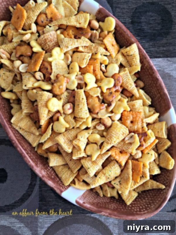 Touchdown Snack Mix Video 18 An overhead shot of Touchdown Snack Mix in a bowl, showing its crispy, coated texture.