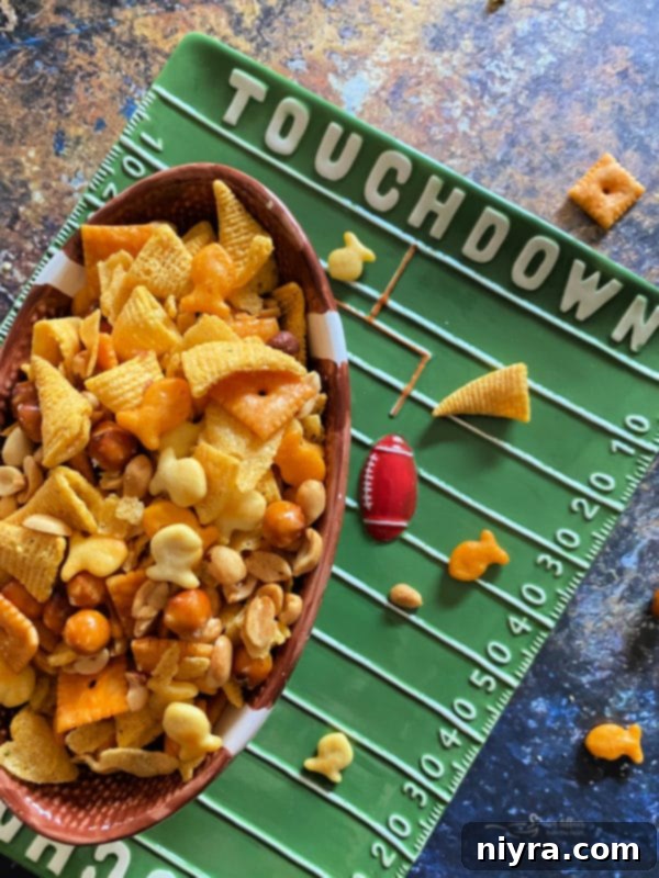 Touchdown Snack Mix Video 4 A bowl overflowing with Touchdown Snack Mix, ready for sharing at a party or game day event.