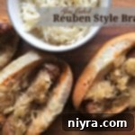 Slow Cooker Reuben Brats 11 overhead of 3 brats and a bowl of kraut with text "Slow Cooked Reuben Style Brats"
