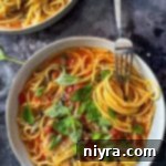 One-Pot Italian Magic 14 A fork twirling the pasta in a bowl of Italian Wonder Pot.