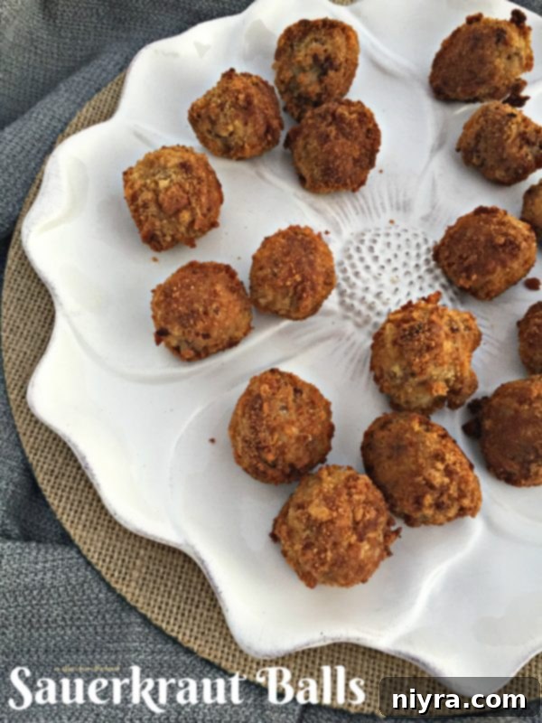 Golden-brown Sauerkraut Balls arranged beautifully on a serving platter, ready to be enjoyed.