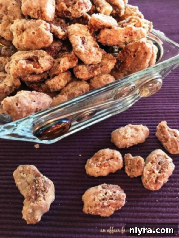 Candied Pecans 2 Delicious Sugared Pecans in a clear bowl, ready to be enjoyed as a snack or gift item.