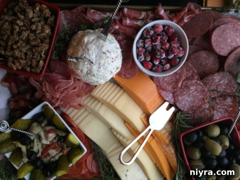 Candied Pecans 6 Charcuterie board featuring a variety of cheeses, meats, fruits, and sugared pecans as a sweet addition.