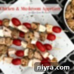 Italian Chicken & Mushroom Appetizer on a white plate with text of the same.