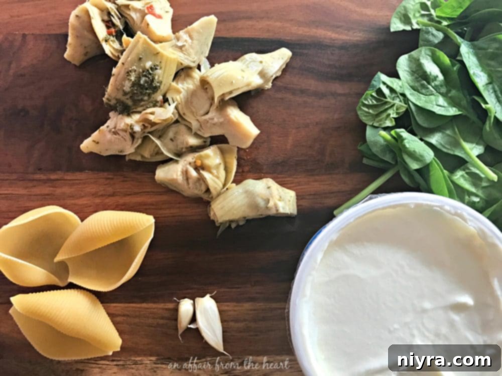 Ingredients being prepared for Spinach & Artichoke Stuffed Shells