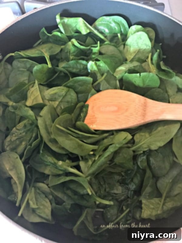 Fresh spinach ready for wilting for the stuffed shells recipe