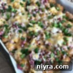 Sheet Pan Reuben Tater Tot Nachos 15 Reuben Sheet Pan Totchos (Tater Tot Nachos) in a baking dish