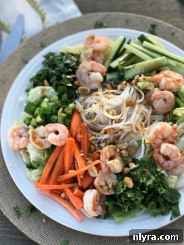 Plated Thai Shrimp & Rice Noodle Salad with dressing