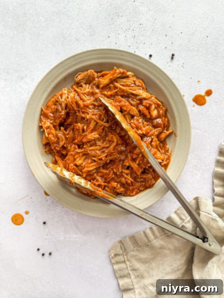 Various ingredients for Dr. Pepper BBQ Pork Sandwiches laid out on a cutting board.