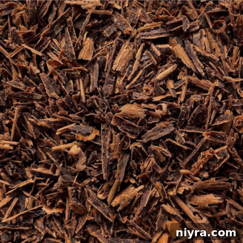 Close-up top view of delicate chocolate shavings, perfect for garnishing French Silk Pie.