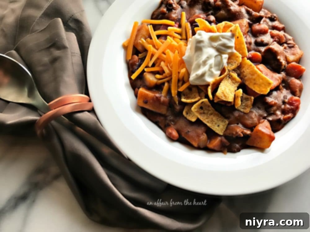 A large pot of simmering Taco Stew on a stovetop, ready to be served.