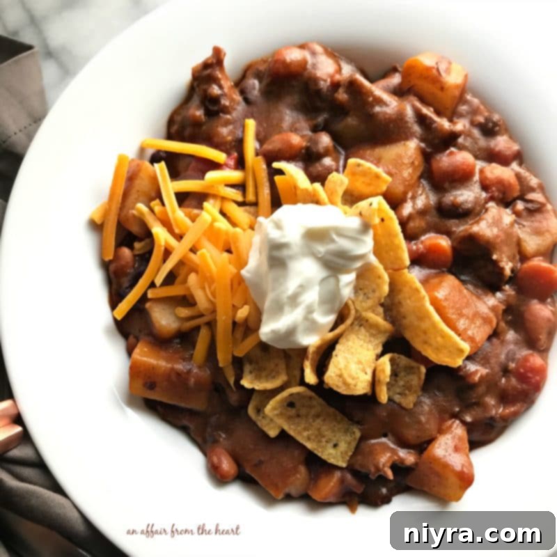 An overhead shot of Taco Stew in a rustic bowl, showcasing its rich texture and colorful ingredients.