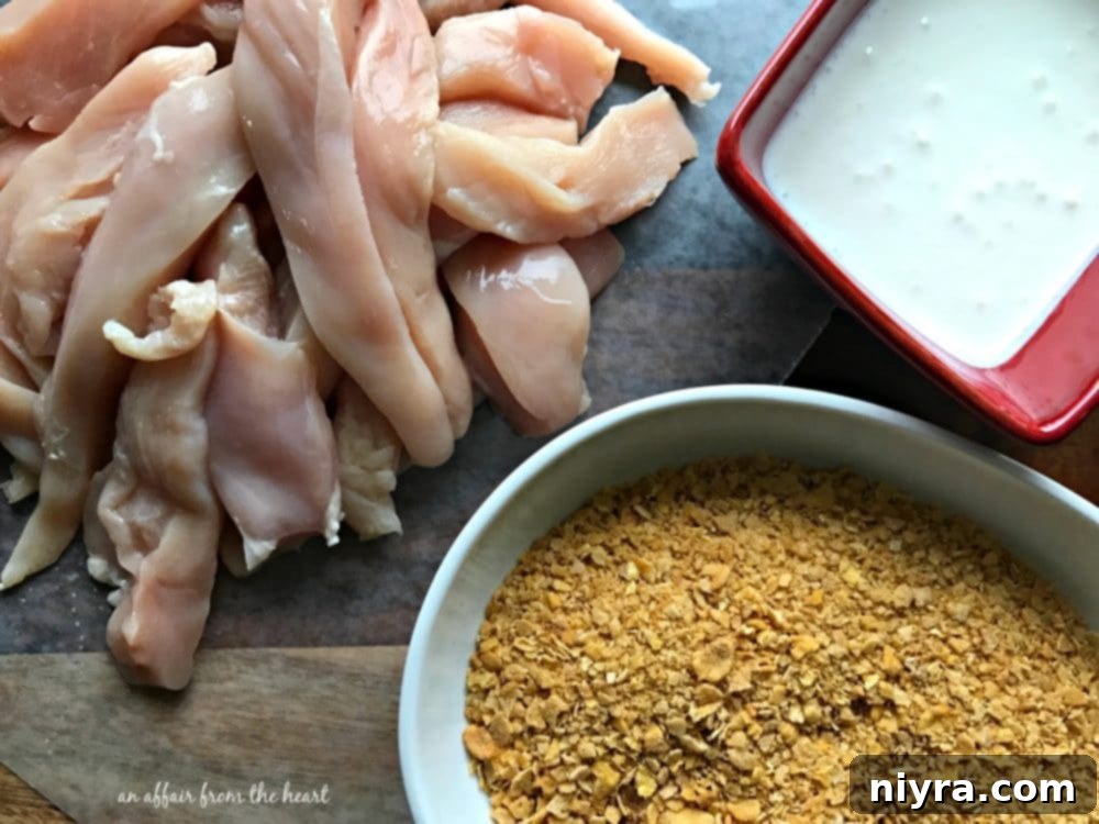 Ingredients laid out for preparing spicy baked chicken tenders: chicken, buttermilk, and seasoned corn flakes