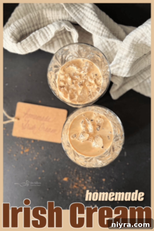 Velvet Irish Liqueur from Scratch 6 A close-up shot of homemade Irish Cream in a glass, showcasing its luxurious, smooth texture.