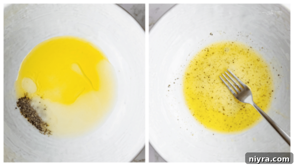 A large mixing bowl containing the dressing ingredients: olive oil, lemon juice, salt, and pepper, with a fork.