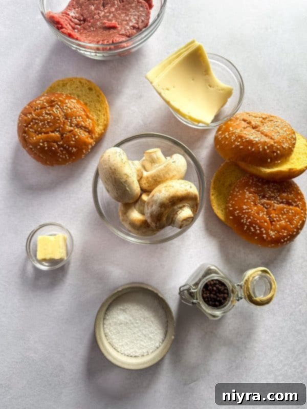 A side shot of a prepared Mushroom Swiss Burger, showcasing the layers of beef, mushrooms, and Swiss cheese.