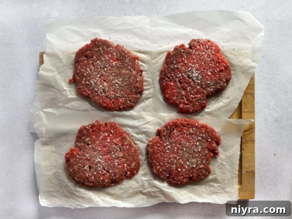 Step-by-step image of seasoning burger patties with salt and pepper.