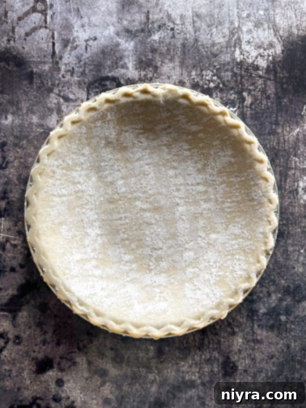 Pie crust being placed into a pie plate
