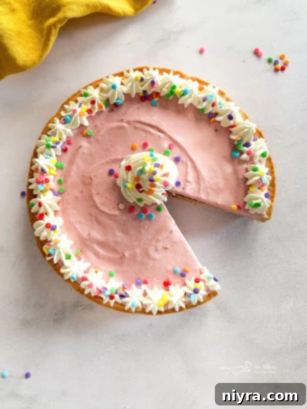 Softened ice cream being spread over the hardened chocolate layer in the springform pan
