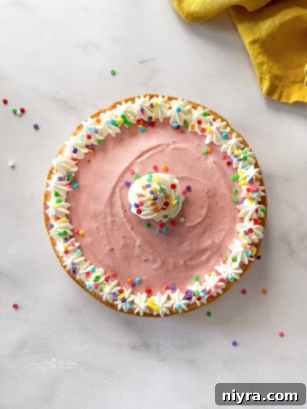 A serving of Ice Cream Cookie Cake with a fork, highlighting the creamy texture