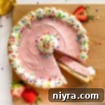 Cutting a slice from the Ice Cream Cookie Cake on a wood board