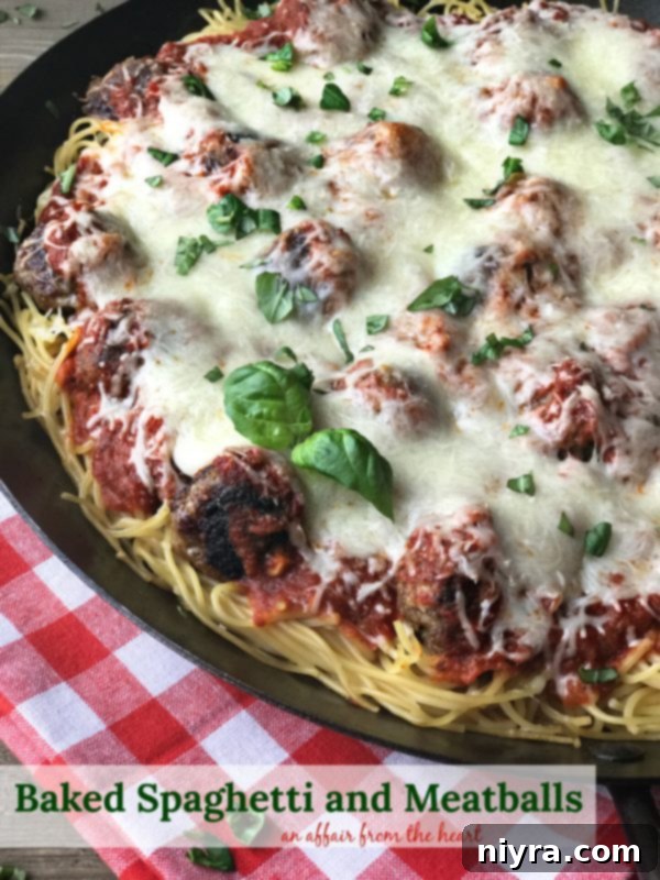 A slice of Baked Spaghetti and Meatballs on a plate