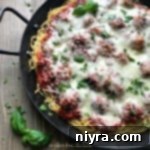close up of Baked Spaghetti and Meatballs in a pan