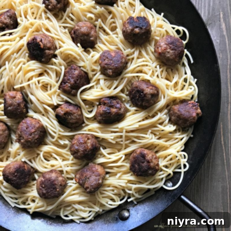 Spaghetti and meatballs layered in a baking dish