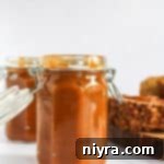 Side view of the pumpkin butter in a mason jar