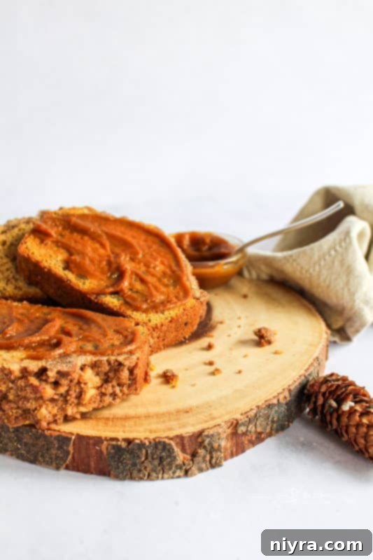 A close-up shot of pumpkin butter in a jar, highlighting its smooth texture and rich color.