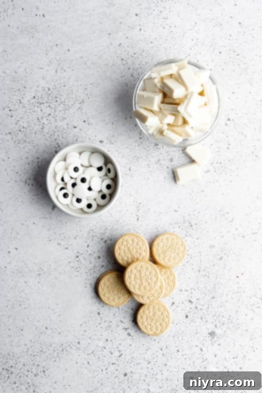 Close-up of Halloween Mummy Bark pieces, highlighting the cracked chocolate and Oreo chunks.