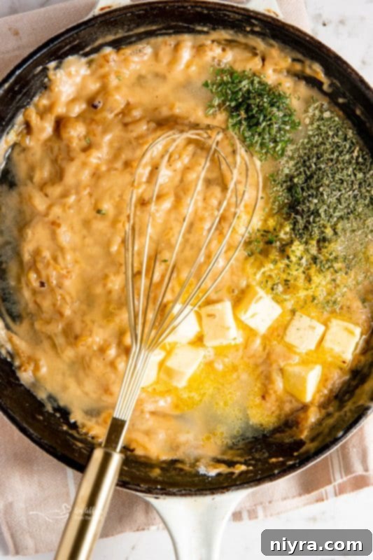 Remaining ingredients added to the sauce, simmering.