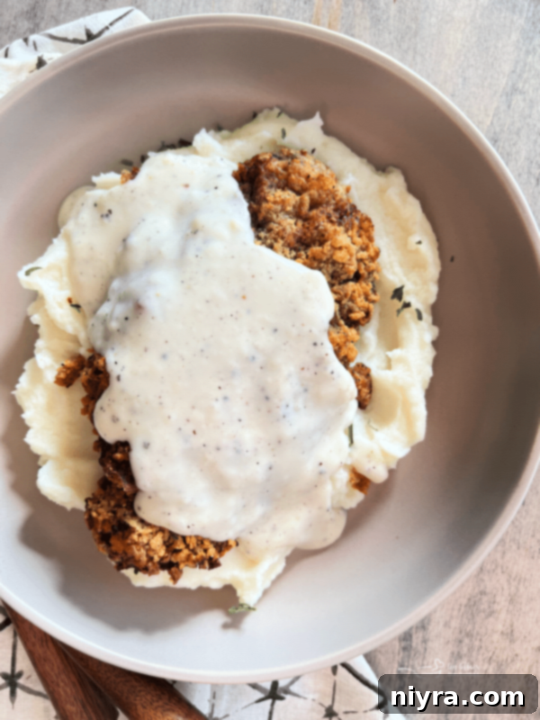 Air Fryer Chicken Fried Steak with white gravy, a hearty and satisfying meal.