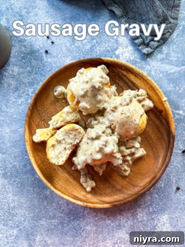 A large skillet filled with homemade sausage gravy, showcasing its rich, thick texture.