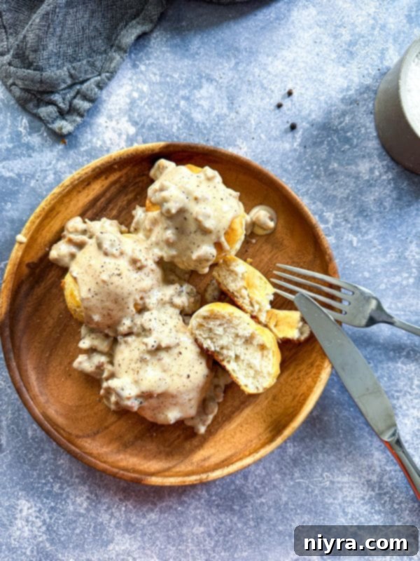 Ingredients laid out on a wooden surface, ready for making homemade sausage gravy.
