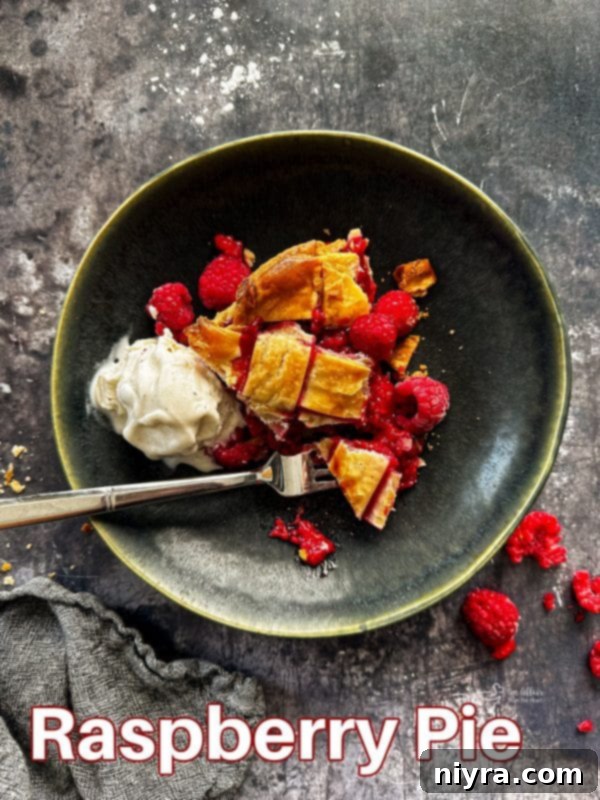 Homemade Raspberry Pie cooling on a rack