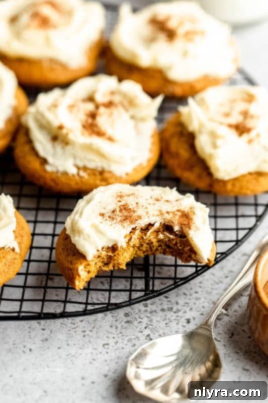 Close-up of frosted soft pumpkin cookies with spices