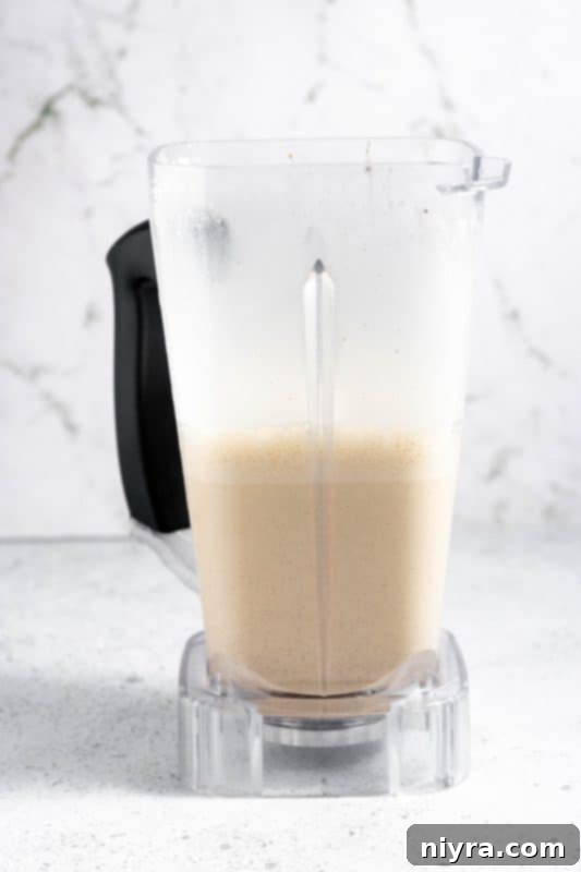 Homemade Blender Eggnog 13 Step 7: Blending all eggnog ingredients together for a final smooth consistency.