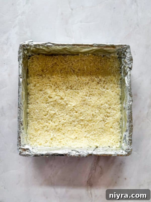 Chewy Coconut Macaroon Blondies 11 Spreading the macaroon mixture evenly over the blondie batter