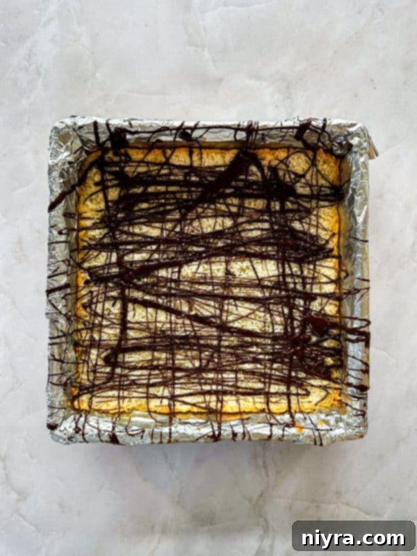 Chewy Coconut Macaroon Blondies 12 Baked Coconut Macaroon Blondies cooling on a rack