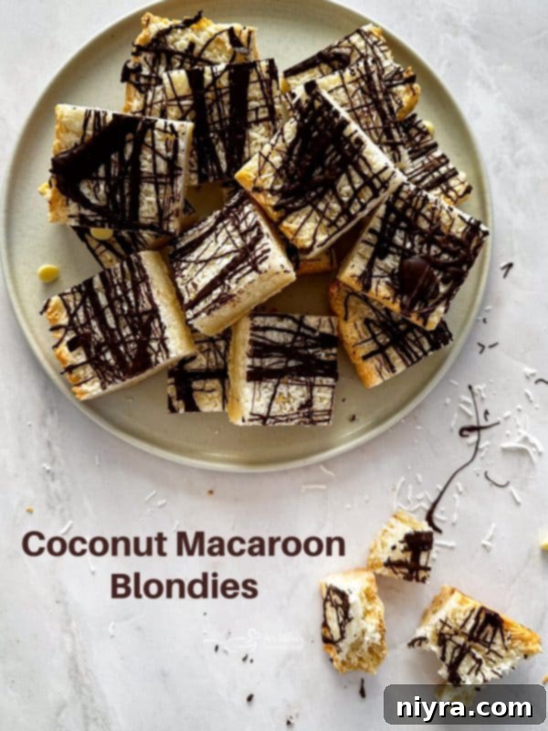Chewy Coconut Macaroon Blondies 18 A perfectly sliced Coconut Macaroon Blondie ready to be eaten