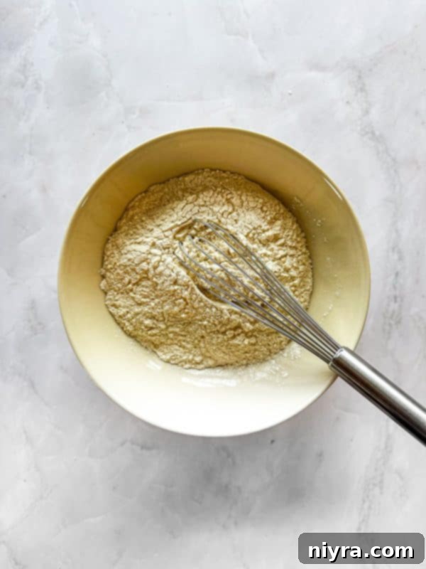 Chewy Coconut Macaroon Blondies 6 Combining flour, baking powder, and salt for the blondie base